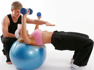 Add abdominal exercises with a fitball to your fitness training plan.