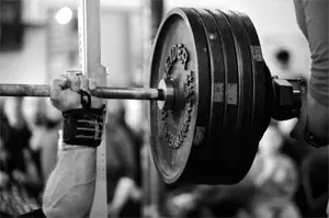 The weightlifter's training method is explosive one-shot work against strength endurance.