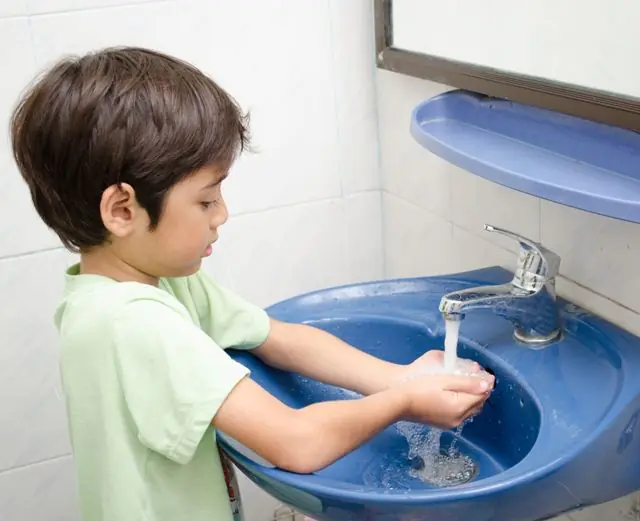 Child washes hands