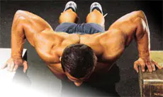 We work on the chest muscles with push-ups.